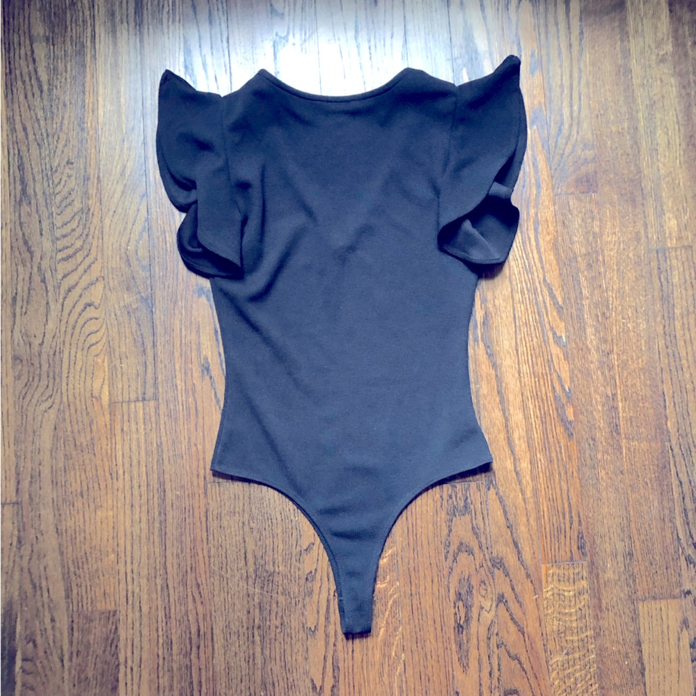 Black One piece body suit with ruffle sleeves size small